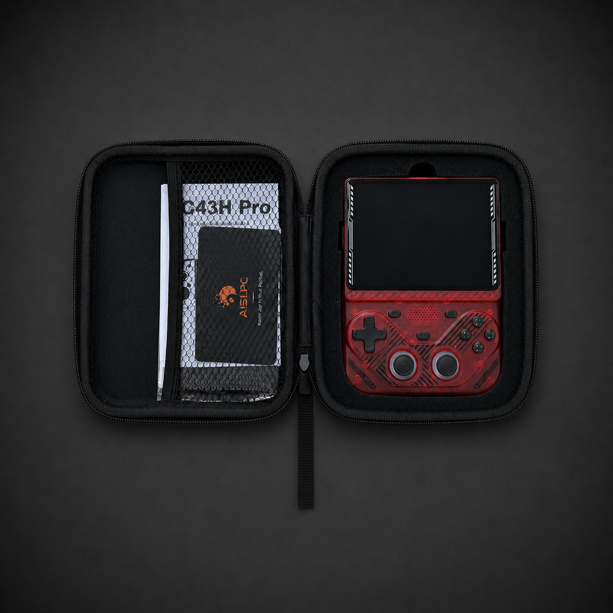 AISLPC RG43V PRO carrying case open view showing the red handheld console, user manual, and protective storage compartments.