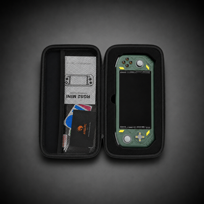 AISLPC RG52 MINI and RG52 PRO MAX carrying case open view showing a green handheld console, user manual, and protective storage compartments.