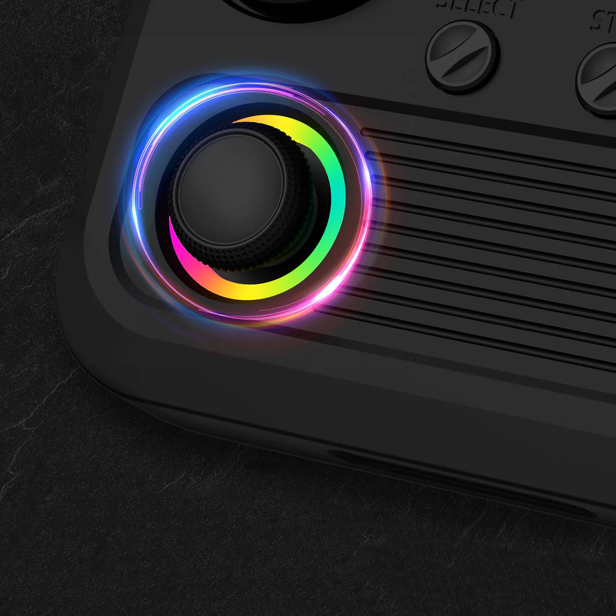 Close-up of the RGB joystick on a black R36T retro gaming handheld console, highlighting the colorful illuminated control design.